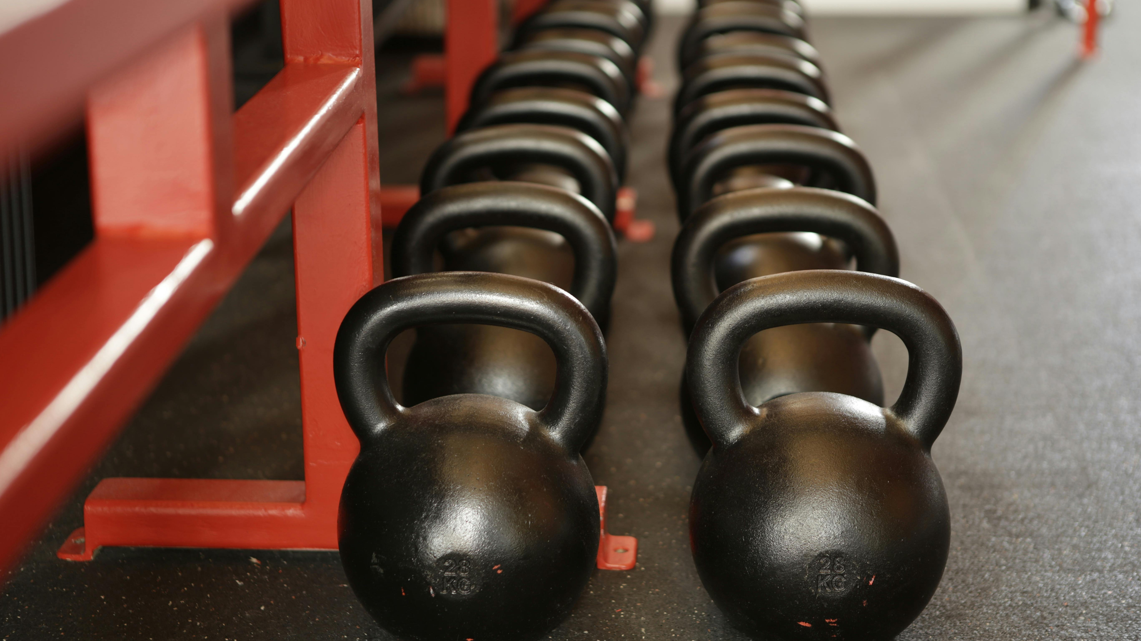 Why Dumbbells and Kettlebells Are Essential for Any Gym